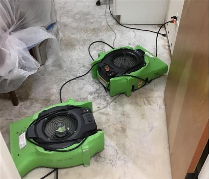 Air movers in a room.
